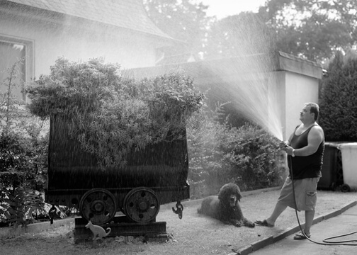 A man in front of a house
